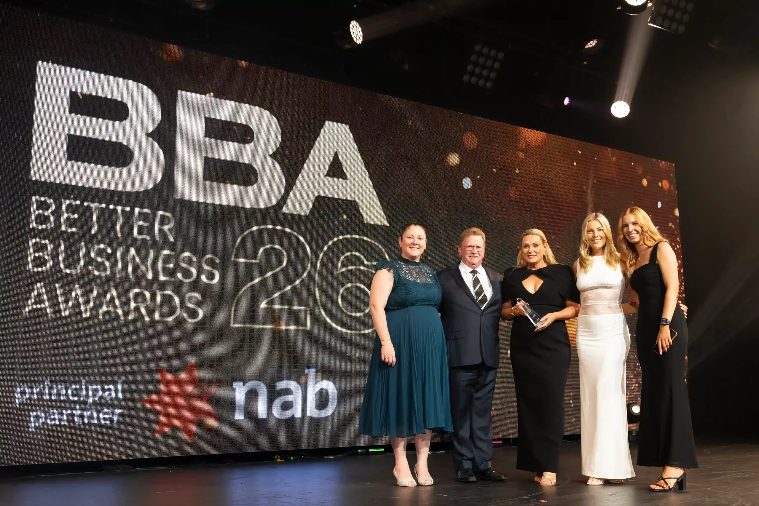 Smart Lending team accepting a trophy at the 2026 Better Business Awards (BBA), representing an award-winning mortgage broker in Melbourne.
